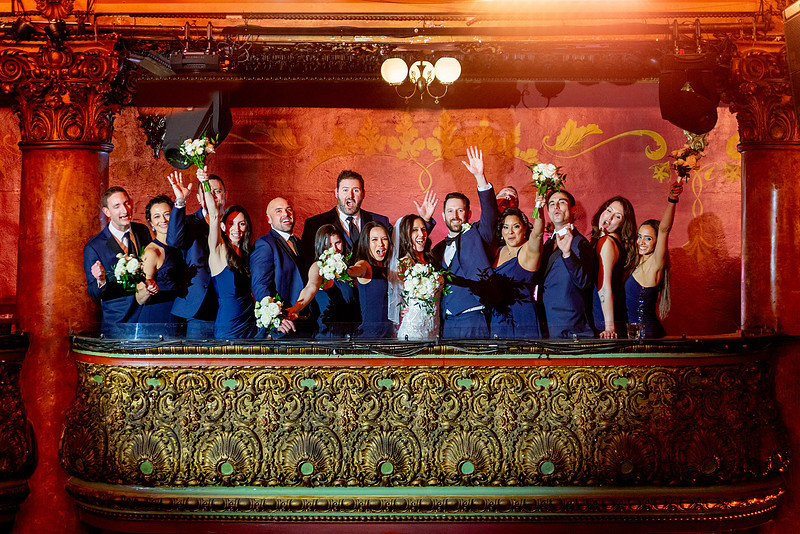 Bridal party celebrating from the upper balcony at the Great American Music Hall.