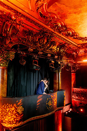 Bride and groom standing at the balcony entrance inside the Great American Music Hall.